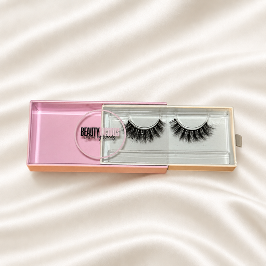 Jave faux lashes in pink packaging on soft ivory satin