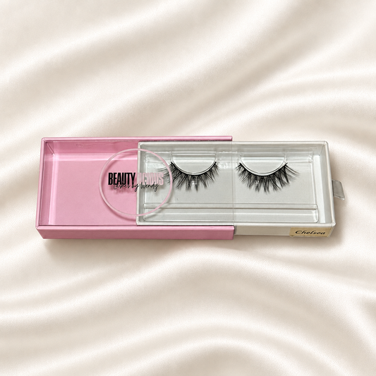 Chelsea faux lashes in pink packaging on soft ivory satin